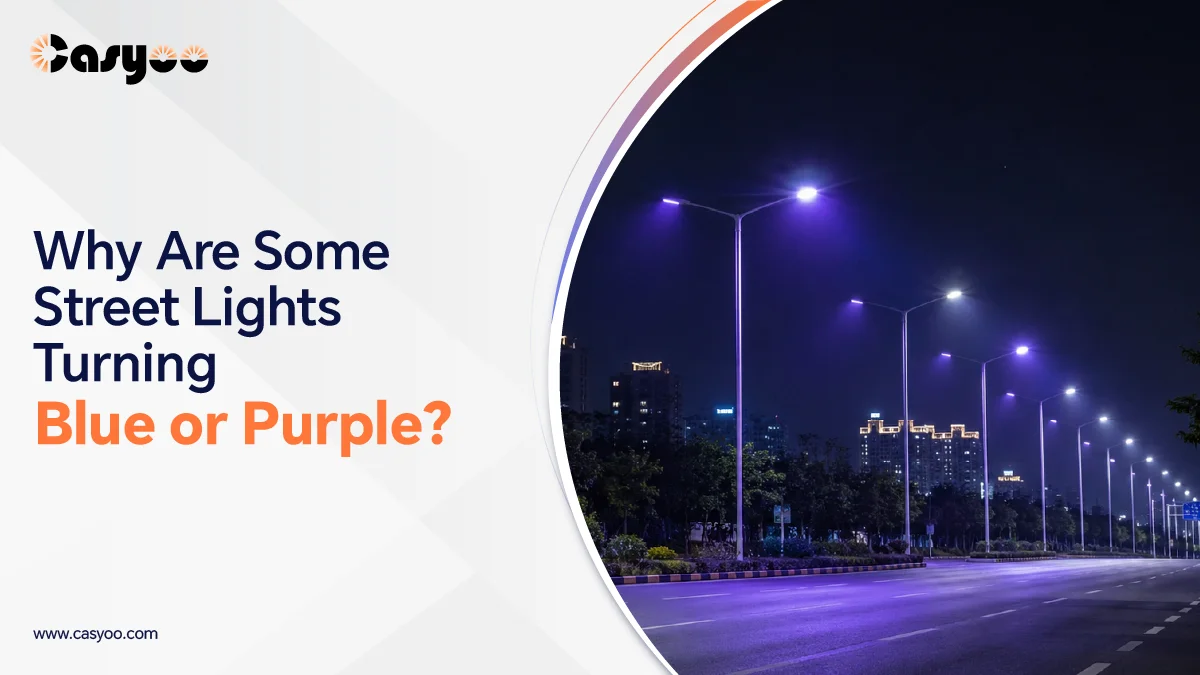 Street lights turning blue and purple along a city road at night